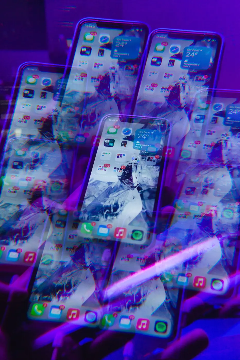 Smartphones glowing in neon light